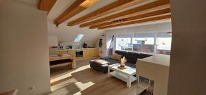 a living room with a couch and a table at Haus Annemarie in Goldkronach