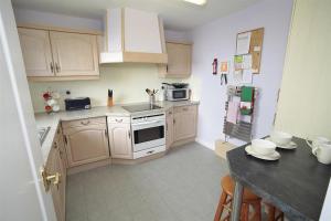 a kitchen with white cabinets and a counter top at 1 Bed in Langland oc-hh147 in Newton