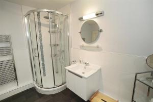 a white bathroom with a shower and a sink at 1 Bed in Langland oc-hh147 in Newton +20 photos