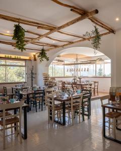 a dining room with wooden tables and chairs at Tenuta dei Normanni in Salerno