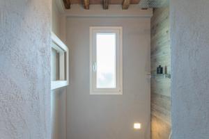 a bathroom with a window and a walk in shower at Il Nido 2&2 in Staggiano +35 photos