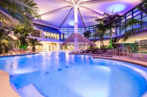 a large swimming pool in a building with a large building at Die Blaue Pause 29 in Weißenstadt