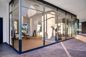 a glass facade of a building with glass windows at Saeta 13B Calpe - Ifach Holiday Homes in Calpe