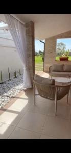 a living room with a couch and a table at Residence Sa Pintadera in Càbras