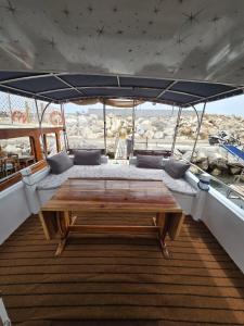 a table on the back of a boat at YourTourKey Gulet Accommodation in Güvercin Adası