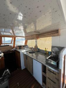 a kitchen in the middle of a boat at YourTourKey Gulet Accommodation in Güvercin Adası