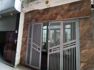a front door of a building with metal gates at J&J guest house in Hanoi +19 photos