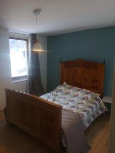 a bedroom with a bed and a window at Casa vacanze Feltre in Feltre