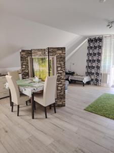 a dining room with a table and chairs at Apartment 28 in Stadthagen