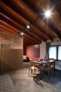 a dining room with a table and chairs at Terrazza Retica in Piateda +43 photos
