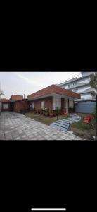 two pictures of a house and a building at The carmine house-Private 4 BHk luxury retreat in sector 132, Noida in Noida
