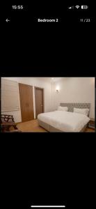 a picture of a bedroom with a bed at The carmine house-Private 4 BHk luxury retreat in sector 132, Noida in Noida