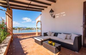 a patio with a couch and a table at Es Clot in Alcudia