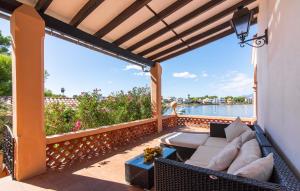 a patio with a couch and a table at Es Clot in Alcudia