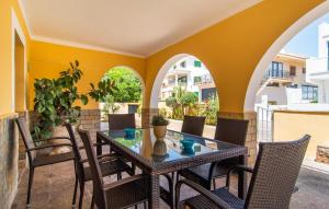 an outdoor patio with a table and chairs at Calamari 7 in Portocolom +39 photos
