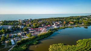 an aerial view of a town next to a river at Mielno Hotel Boutique in Mielno