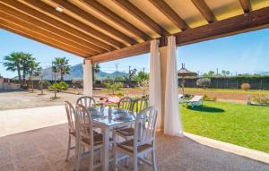 a table and chairs on a patio with a view at Can Ferrer in Alcudia