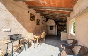 a patio with a table and chairs and a fireplace at Clonenell in Canyamel +26 photos