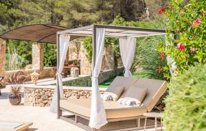 a gazebo on a patio with a swing at Casa Amorena in Felanitx +52 photos