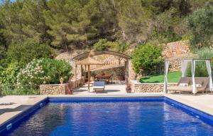 a pool with a gazebo and a patio at Casa Amorena in Felanitx