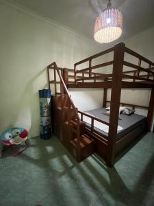 a bedroom with two bunk beds in a room at Gandasari Homestay Banyuwangi in Dadapan