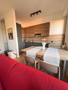 a kitchen and dining room with a table and chairs at Appartamento con vista su Brunate in Olgiate Comasco +23 photos