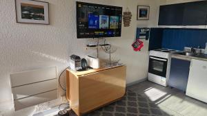 a kitchen with a counter with a phone on it at Col de L'Arzelier in Château-Bernard