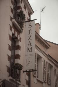 a sign for a hotel on the side of a building at Sezam Appart-Hotel Rennes in Rennes