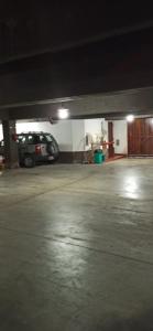 a parking garage with a car parked in it at San Berardo Brava 3 sobre costanera in San Bernardo