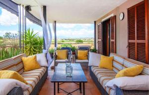 a porch with couches and a coffee table at Villa Son Gat Mallorca in Montuiri