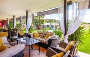 a living room with couches and a table at Villa Son Gat Mallorca in Montuiri +51 photos