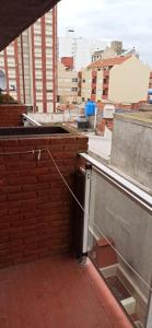 a building with a window on the side of it at San Berardo Brava 3 sobre costanera in San Bernardo +1 photo