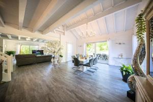 a living room with a couch and a table at Zenitude Villa - Indoor Pool & Jacuzzi in Jezainville