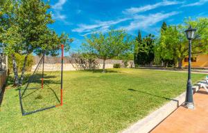 a swing in a park with a street light at Sa Vileta in Sencelles +44 photos