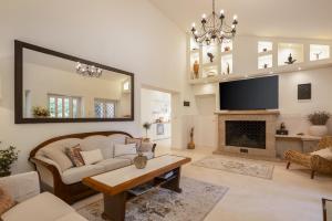 a living room with a couch and a fireplace at Villa Nada - Unique & Artistic in Korčula