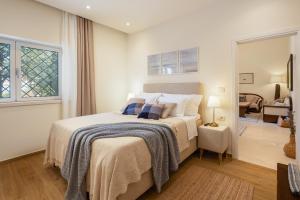 a bedroom with a bed and a living room at Villa Nada - Unique & Artistic in Korčula +43 photos