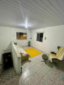 a room with a bed and a couch in a room at Cantinho do Sol in Recife +4 photos