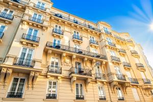 a large building with balconies on the side of it at Résidence Aston la Scala in Nice