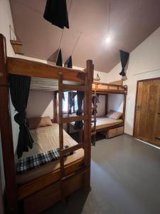a room with two bunk beds in a house at C U Hostel in Trincomalee +15 photos