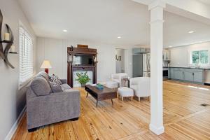a living room with a couch and a table at Private Patio & Pond: Serene Black Mountain Escape in Black Mountain