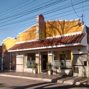 a building with a sign on the side of it at Petit Hotel Las Marias in La Rioja +5 photos