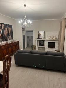 a living room with a couch and a fireplace at A casa di Lena in Genzano di Roma +53 photos