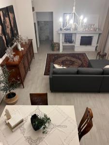 a living room with a couch and a table at A casa di Lena in Genzano di Roma