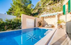 a swimming pool in the backyard of a villa at Ventimar in Canyamel