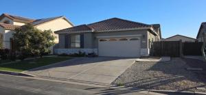 a house with a driveway and a garage at Homes by Abby LLC in Maricopa +8 photos