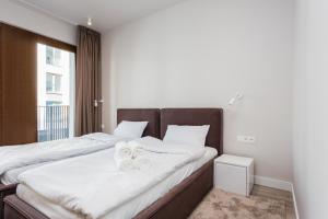 Posteľ alebo postele v izbe v ubytovaní Platinum Residence Mokotów