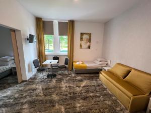 a living room with a couch and a table at HORIZON in Ustka