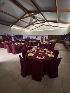 a banquet hall with tables and chairs with food on them at Herdade do Serra in Ervidel +37 photos