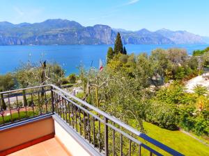 a balcony with a view of the water at Casa Pagani in Brenzone sul Garda