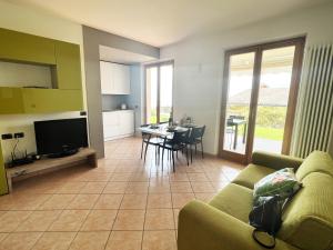 a living room with a couch and a table at Casa Pagani in Brenzone sul Garda
